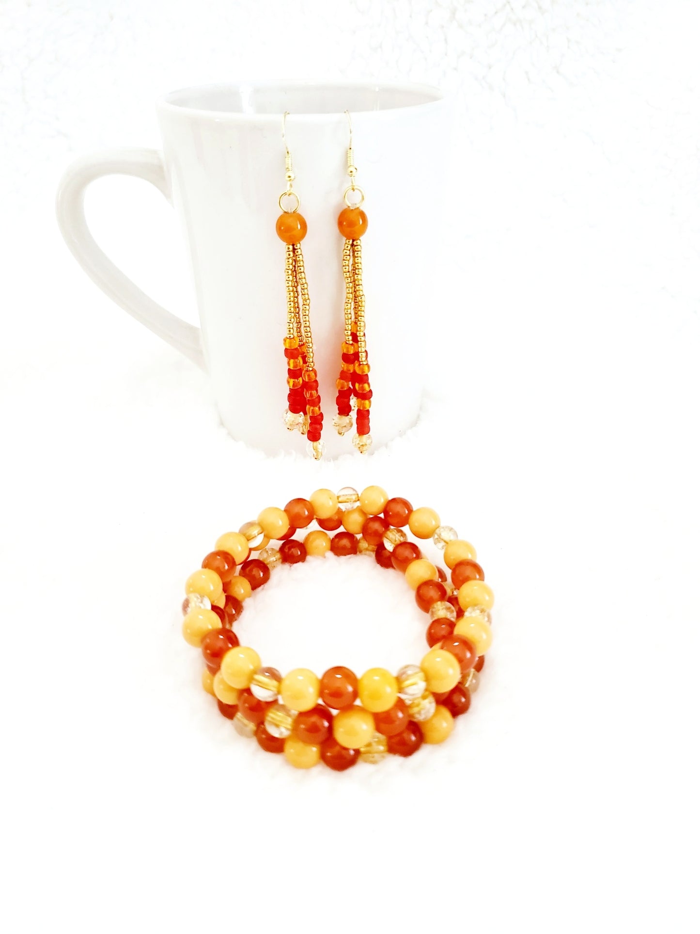 Autumn Sunset Tassel Earrings designed by creator Unique Carper – Chic tassel earrings in mesmerizing shades of red and orange that capture the essence of a captivating sunset. Shop I Am Unique
